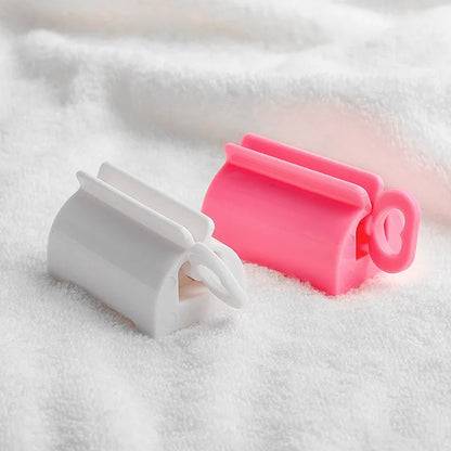 Toothpaste Squeezer Rolling Tube Dispenser